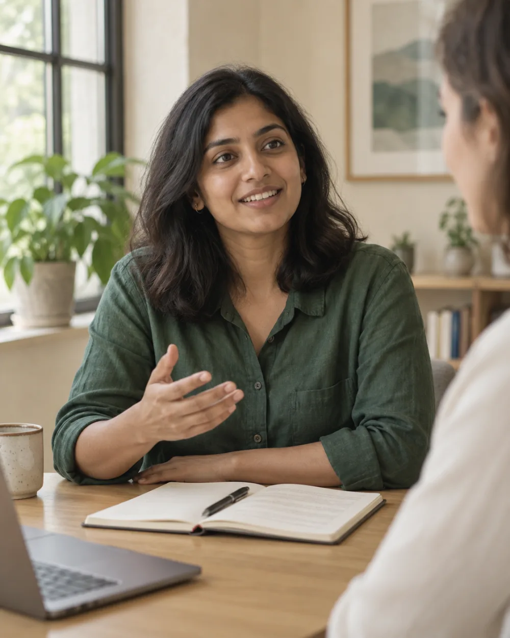 Adult learner talking with a coach across a table